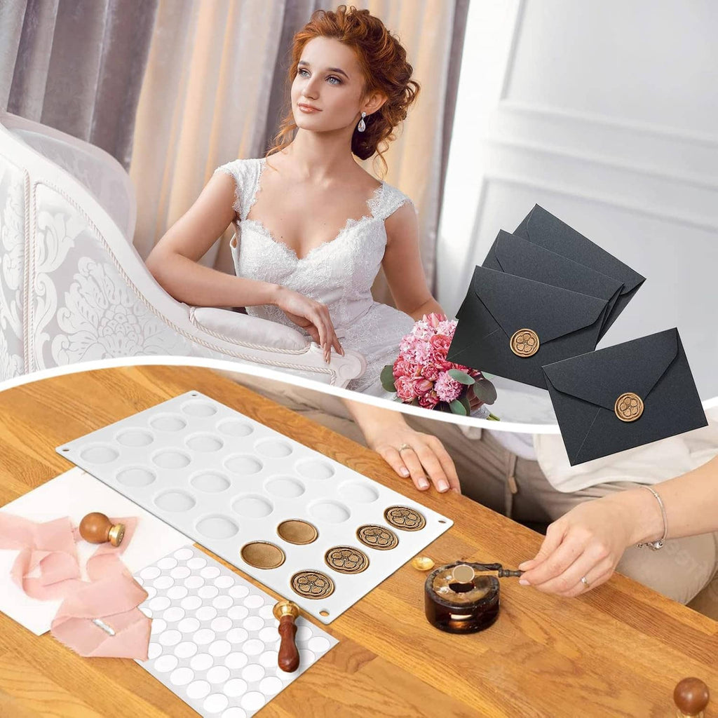 White silicone wax seal mat with round cavities and wax seals on wooden tabletop
