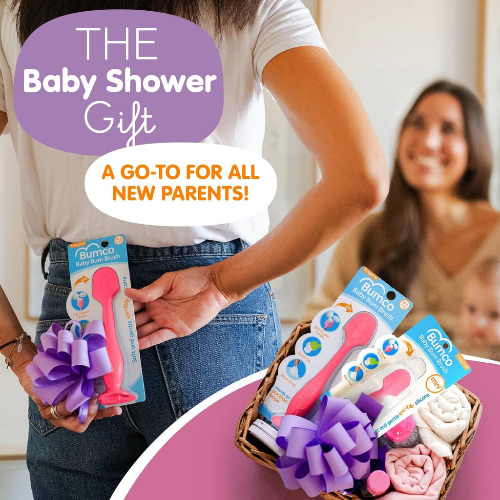 Pink baby bum brush in retail packaging, handheld diaper-area cleaning tool