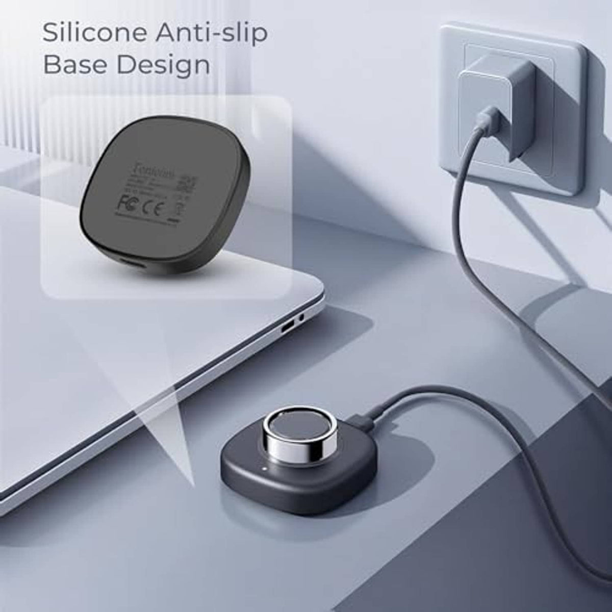 Dark gray charging dock with silicone anti-slip base and connected cable near phone