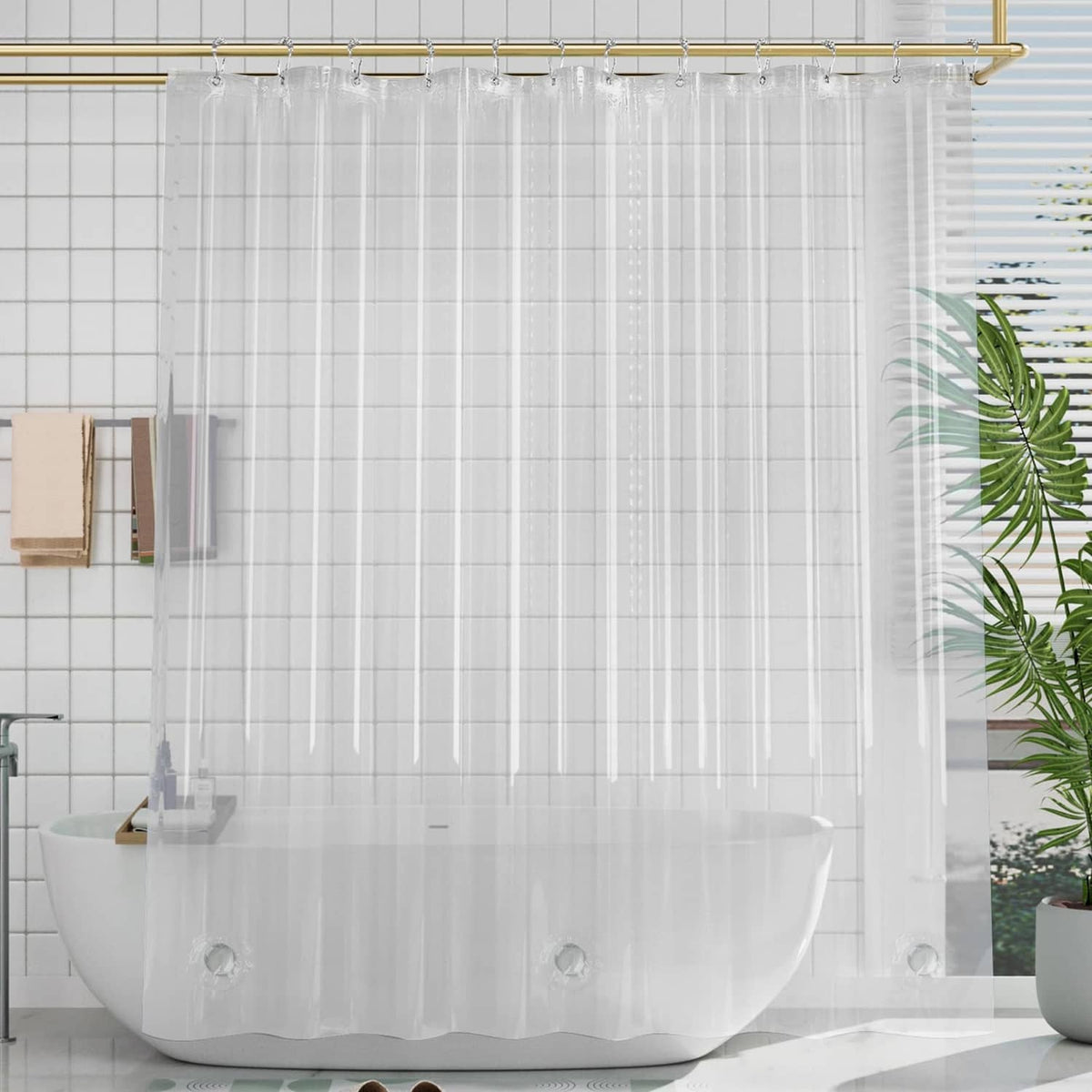 Clear plastic shower curtain liner covering bathtub, full-length transparent panels