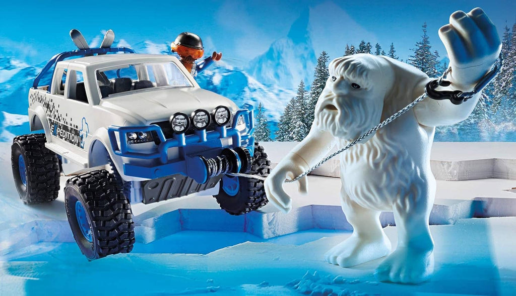 Playmobil off-road snow truck with orange-helmet driver and white dog figure