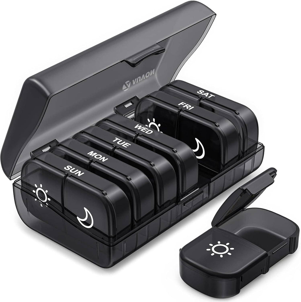 Dark gray weekly pill organizer with AM/PM tray, hinged lid open, labeled days