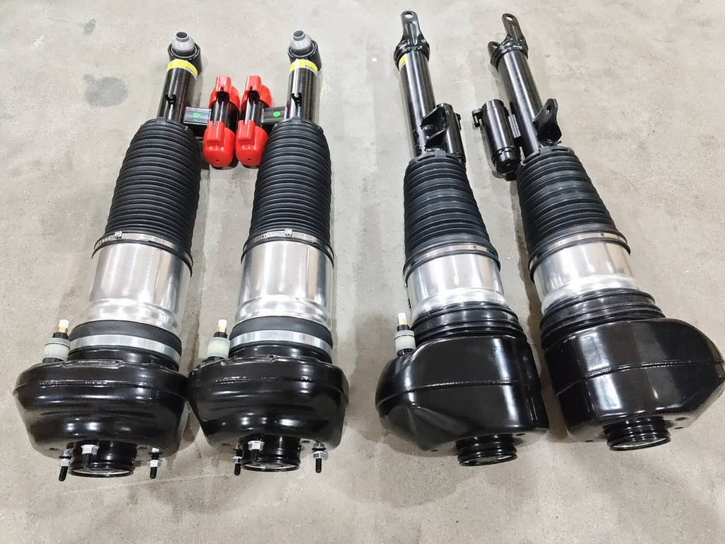 Front air suspension strut assembly with black bellows and silver shock body