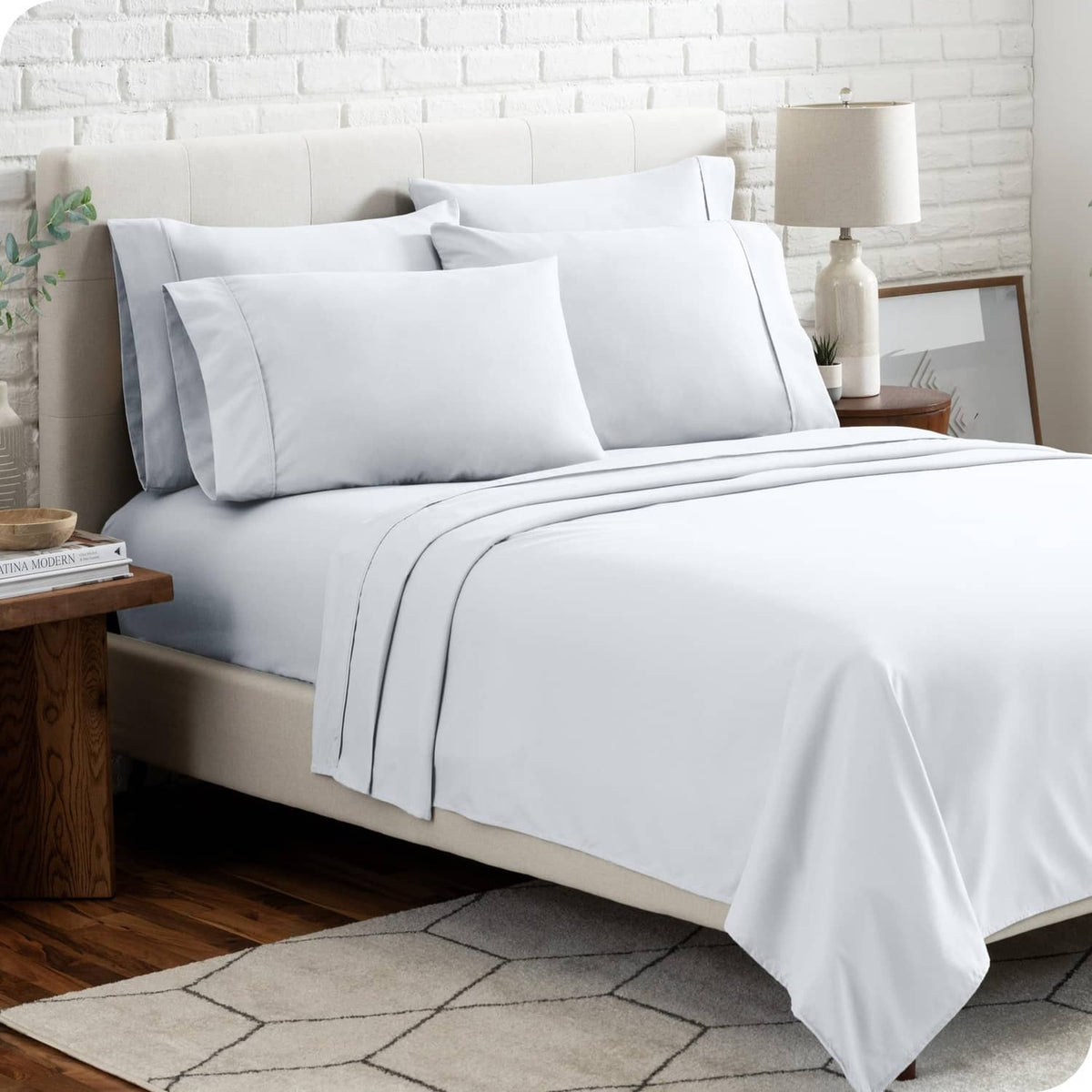 White queen microfiber sheet set with matching pillowcases on a bed