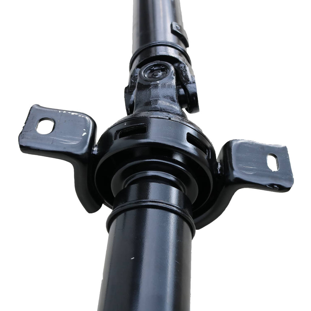 Prop driveshaft bearing housing with black support brackets and rubber mount