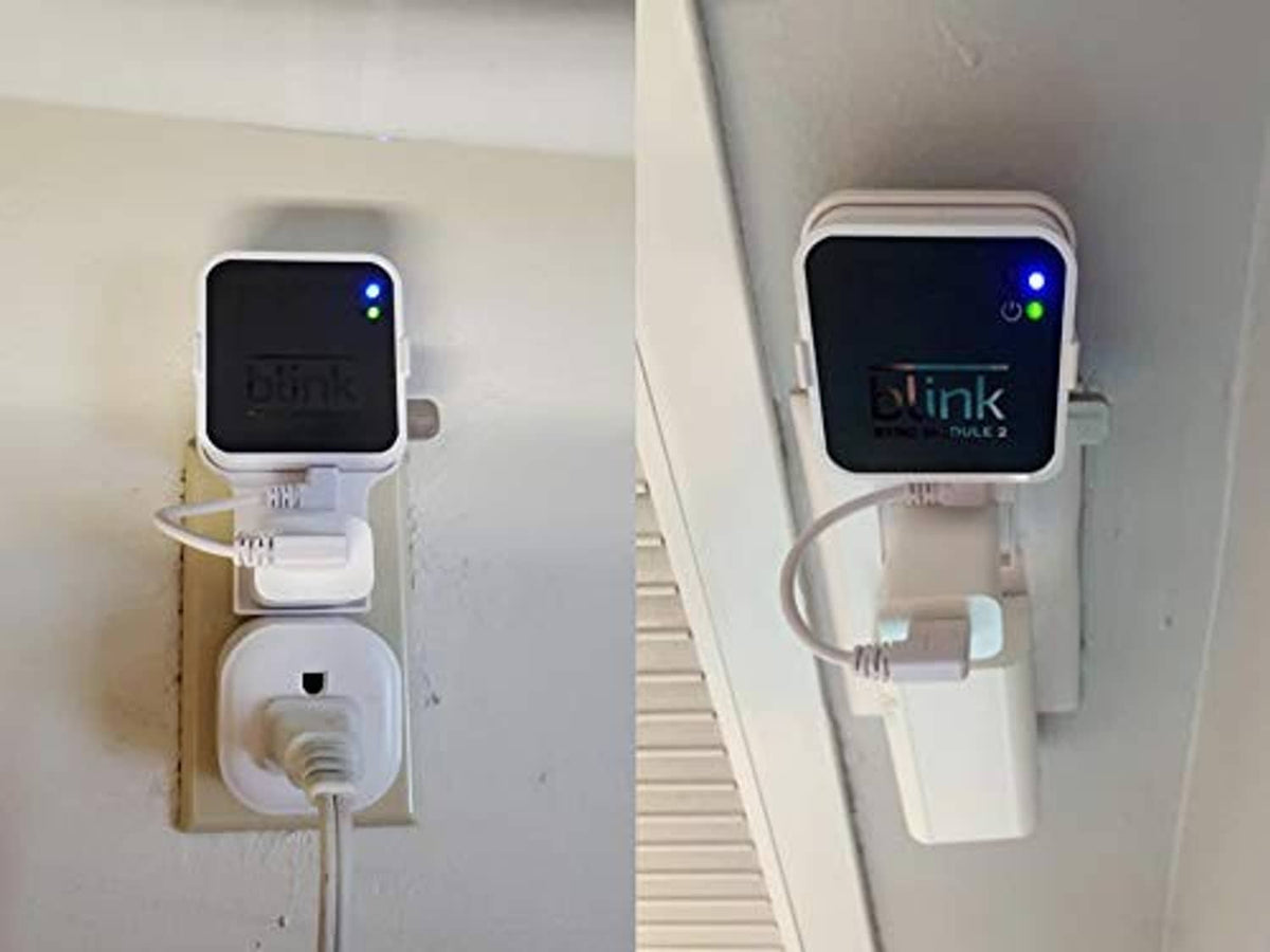 Outlet-mounted Blink Sync Module 2 units showing USB thumb drives on adapters