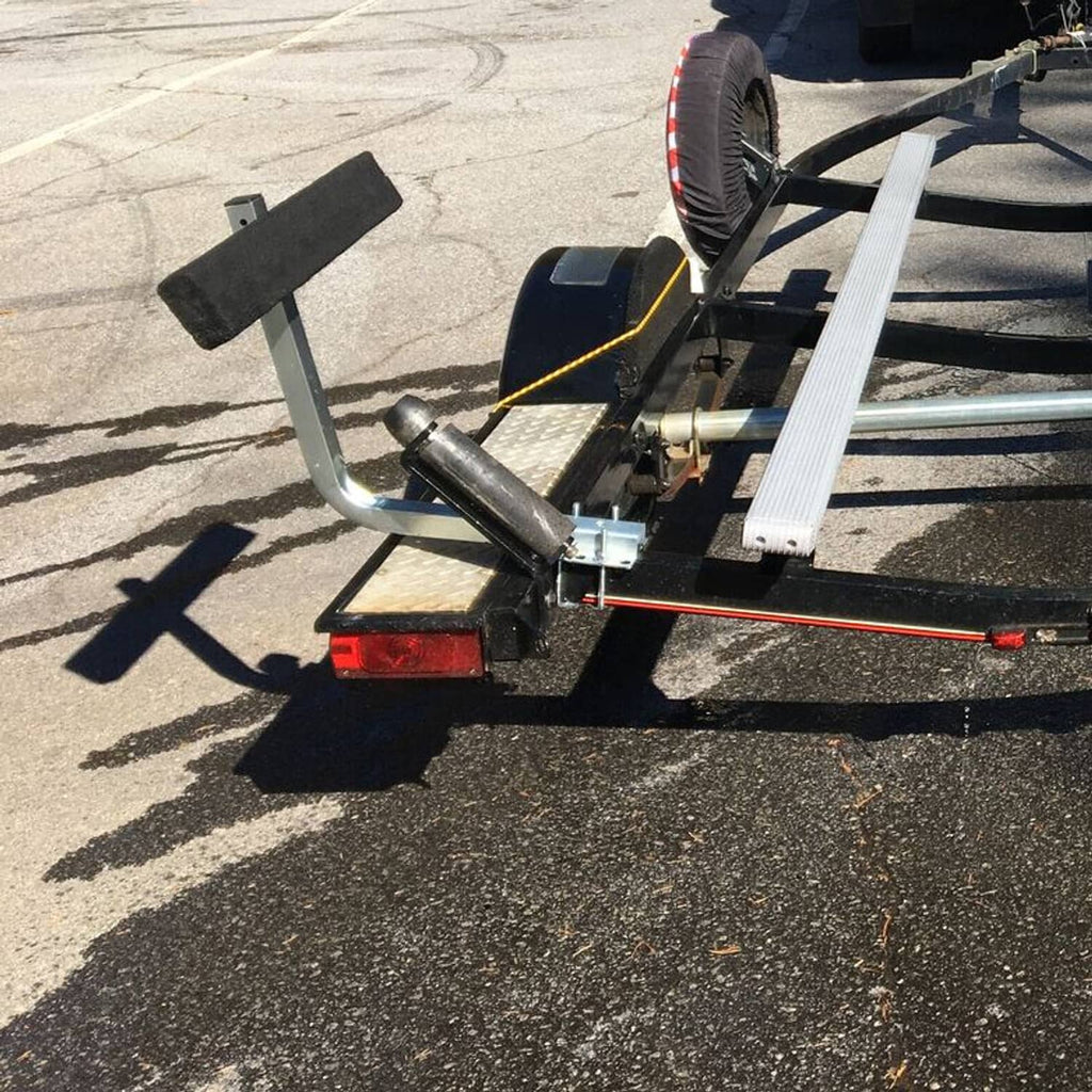 Installed boat trailer guide-on bunk boards with black carpet pads along the rail