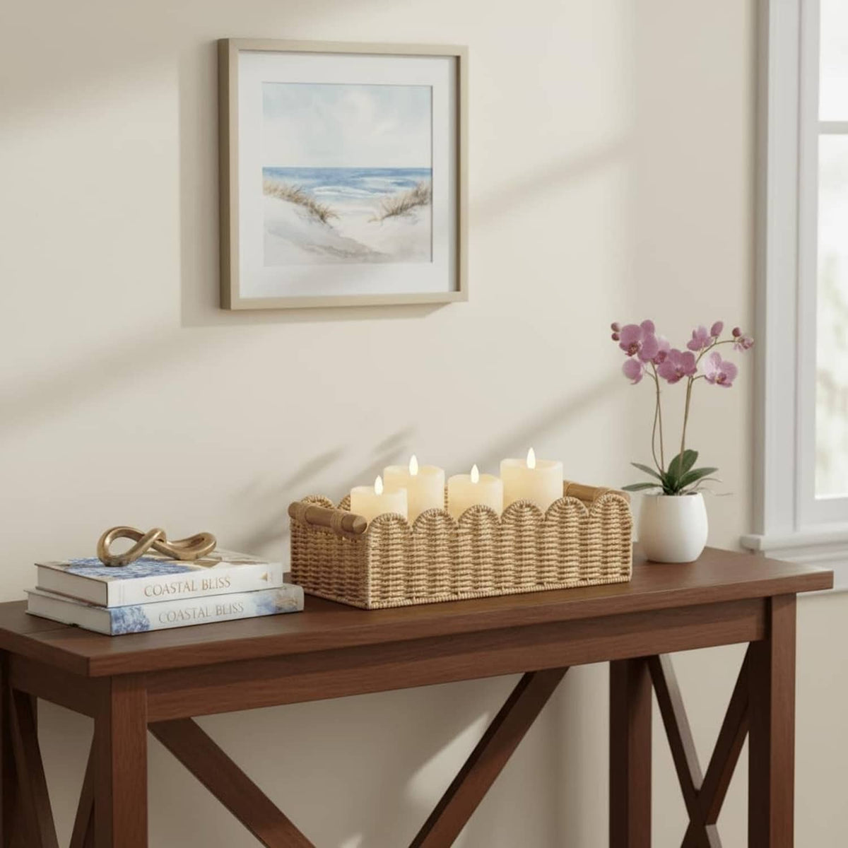 Beige scalloped woven toilet paper storage basket with candle and decor items
