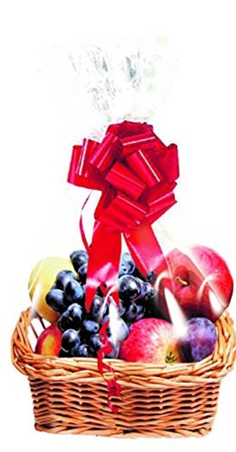 Clear cellophane basket bag wrapping a gift basket with a red ribbon and fruit