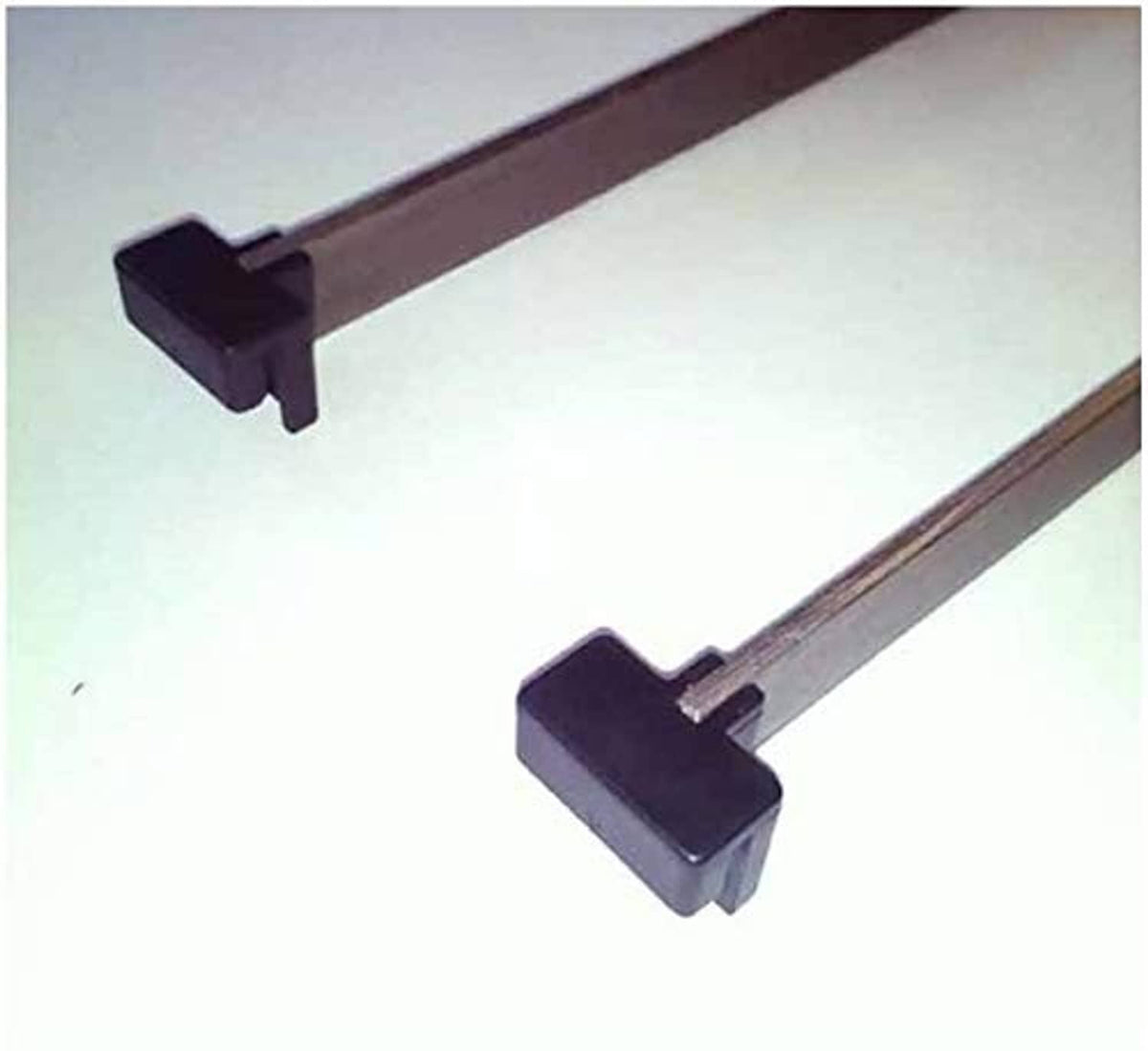 Black hanging file rail clips on a flat bar, showing clip openings