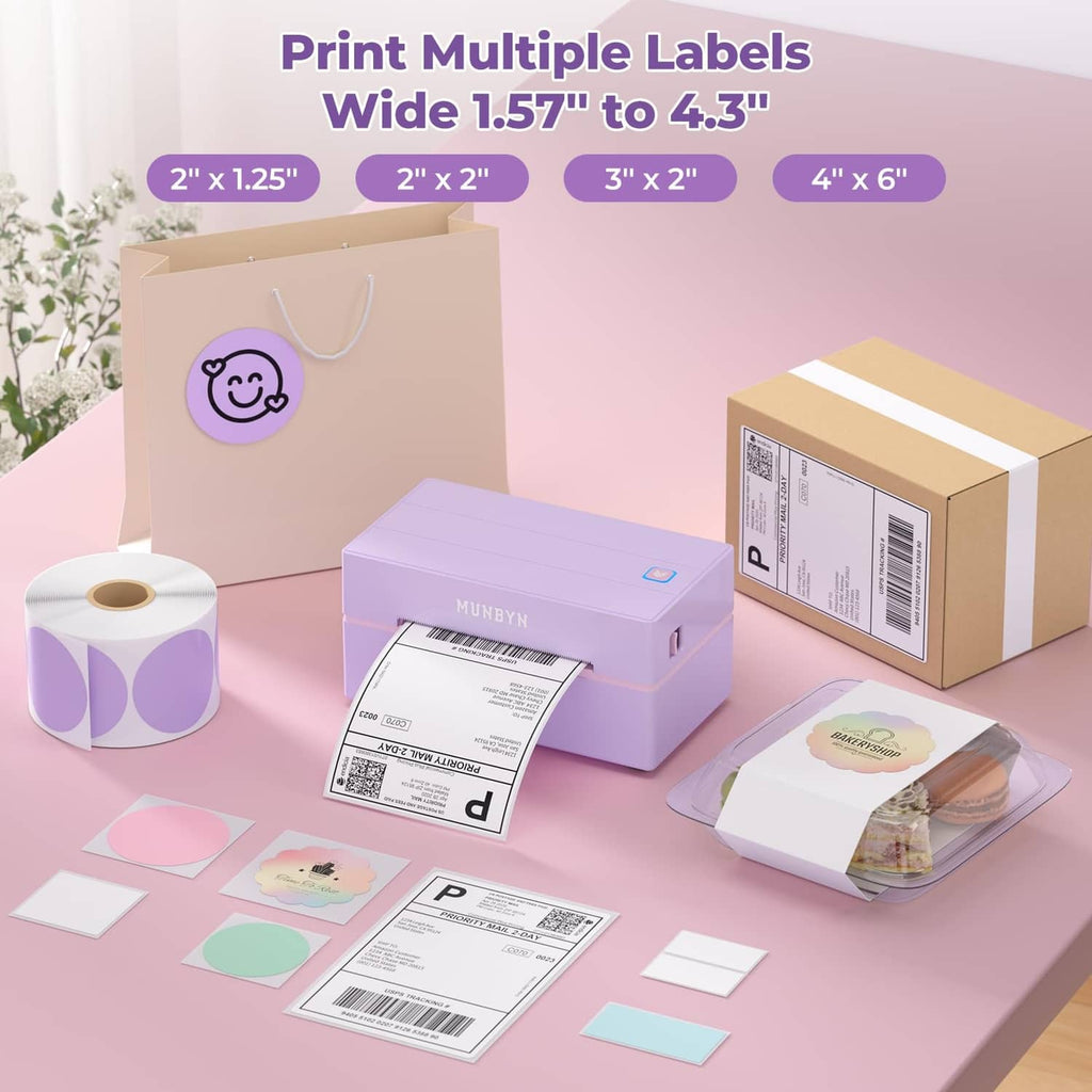 Purple thermal label printer with multiple printed label sheets and shipping boxes