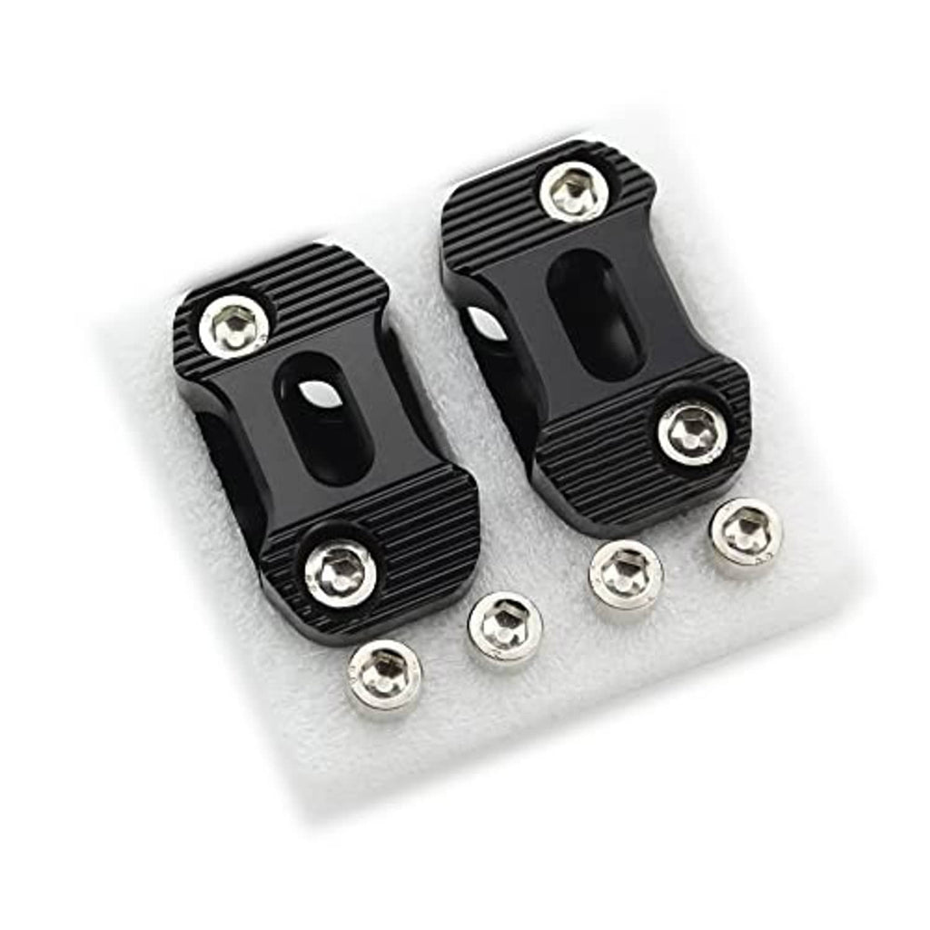 Black handlebar clamp riser halves with bolts and silver round socket screws
