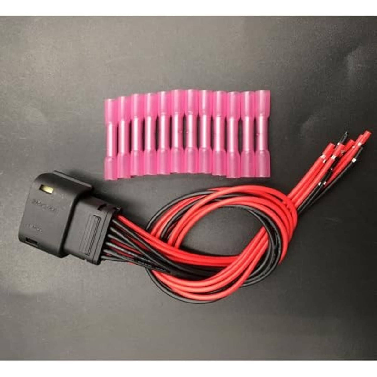 Headlight connector harness with red wire pigtail and 12 pink terminal pins