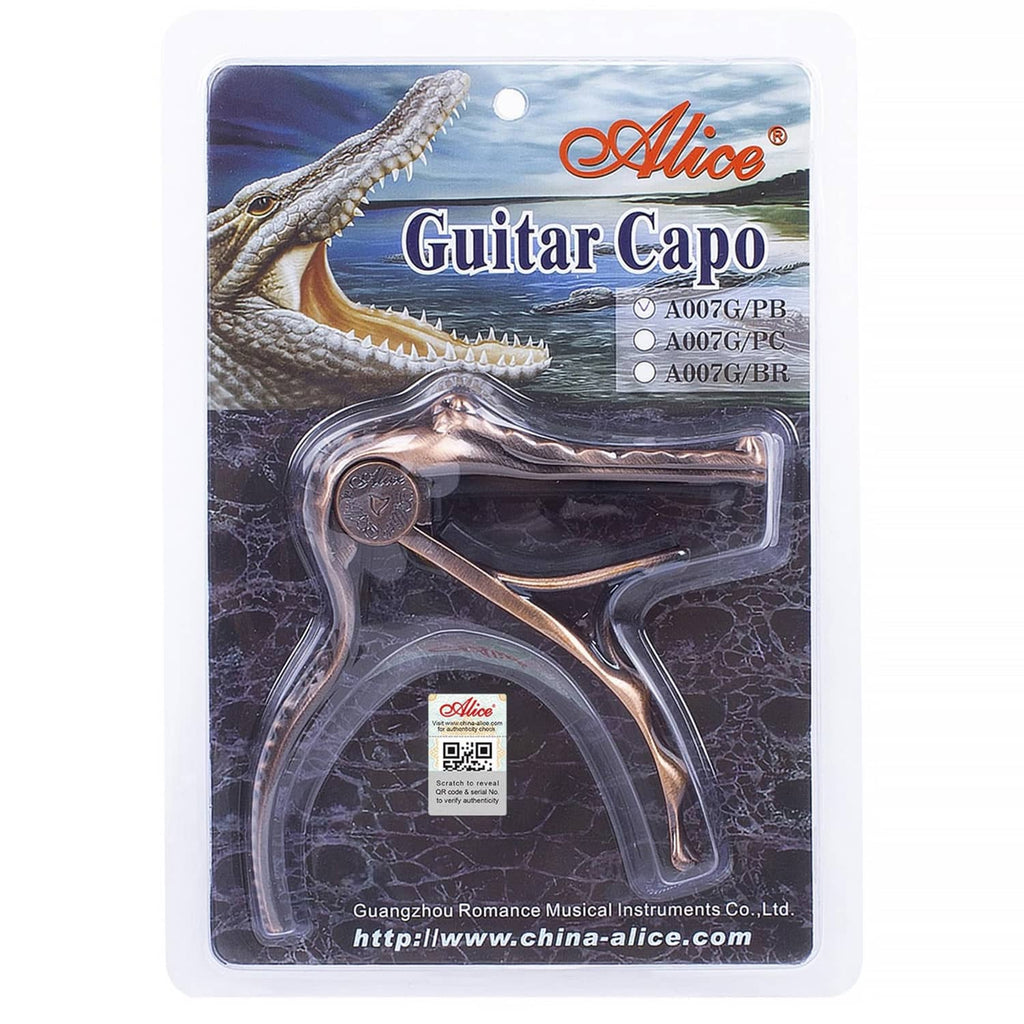 Alligator-style guitar capo in blister packaging, bronze clamp