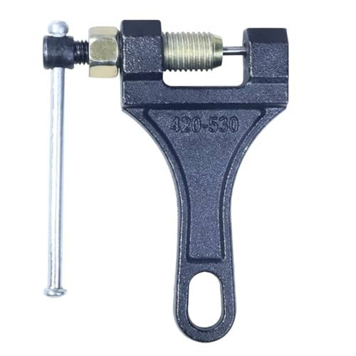 Chain breaker tool showing dark metal frame and threaded screw between mounting blocks