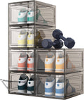 Clear hard-plastic shoe storage boxes with hinged doors, stacked with pairs of sneakers inside