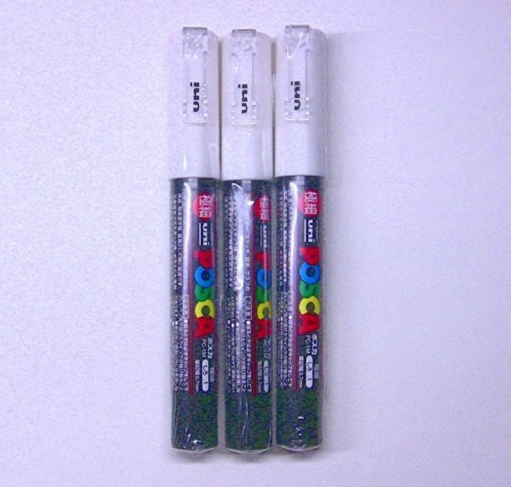 Three Uni Posca PC-1M white paint markers with visible label text, pack of 3