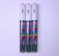 Three Uni Posca PC-1M white paint markers with visible label text, pack of 3