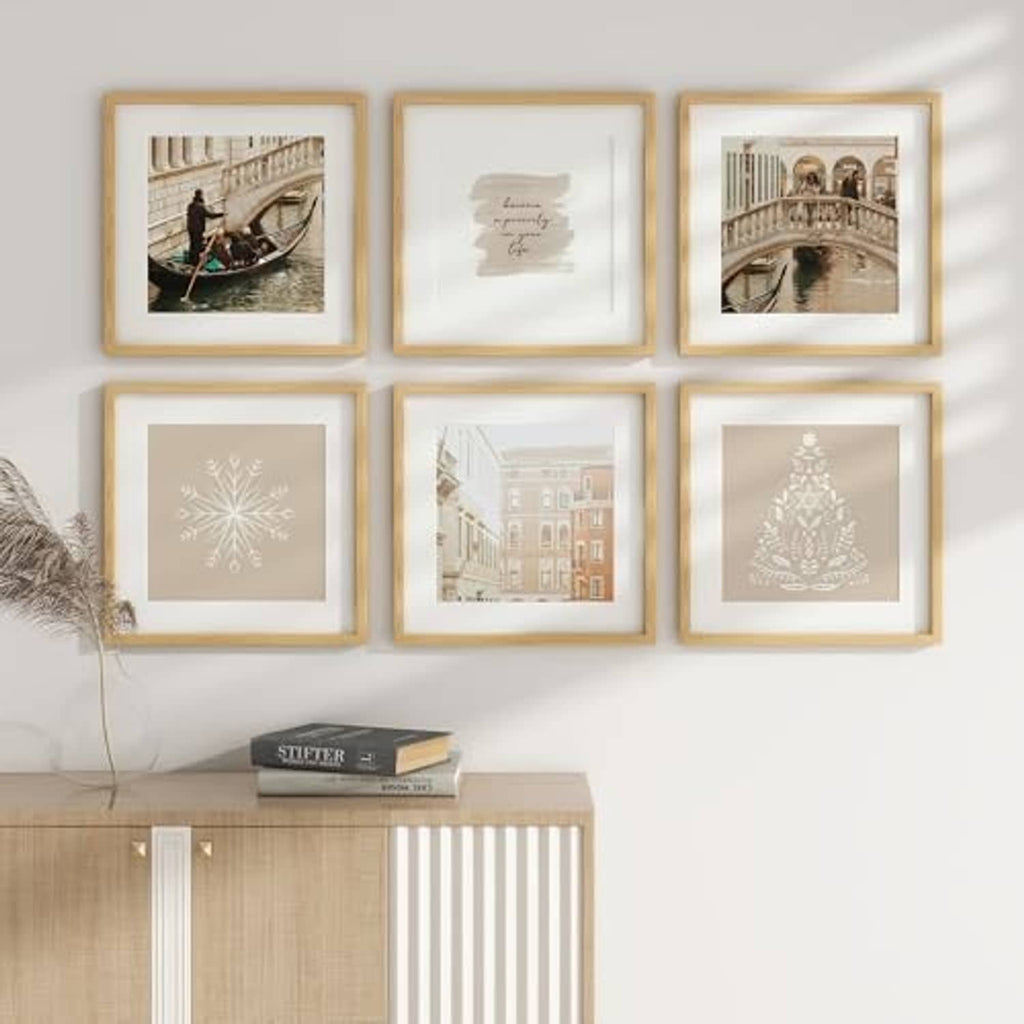 Set of natural oak picture frames in a grid display on a light wall