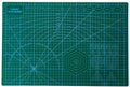 Blue cutting mat with printed grid and protractor lines, 18 x 12 in