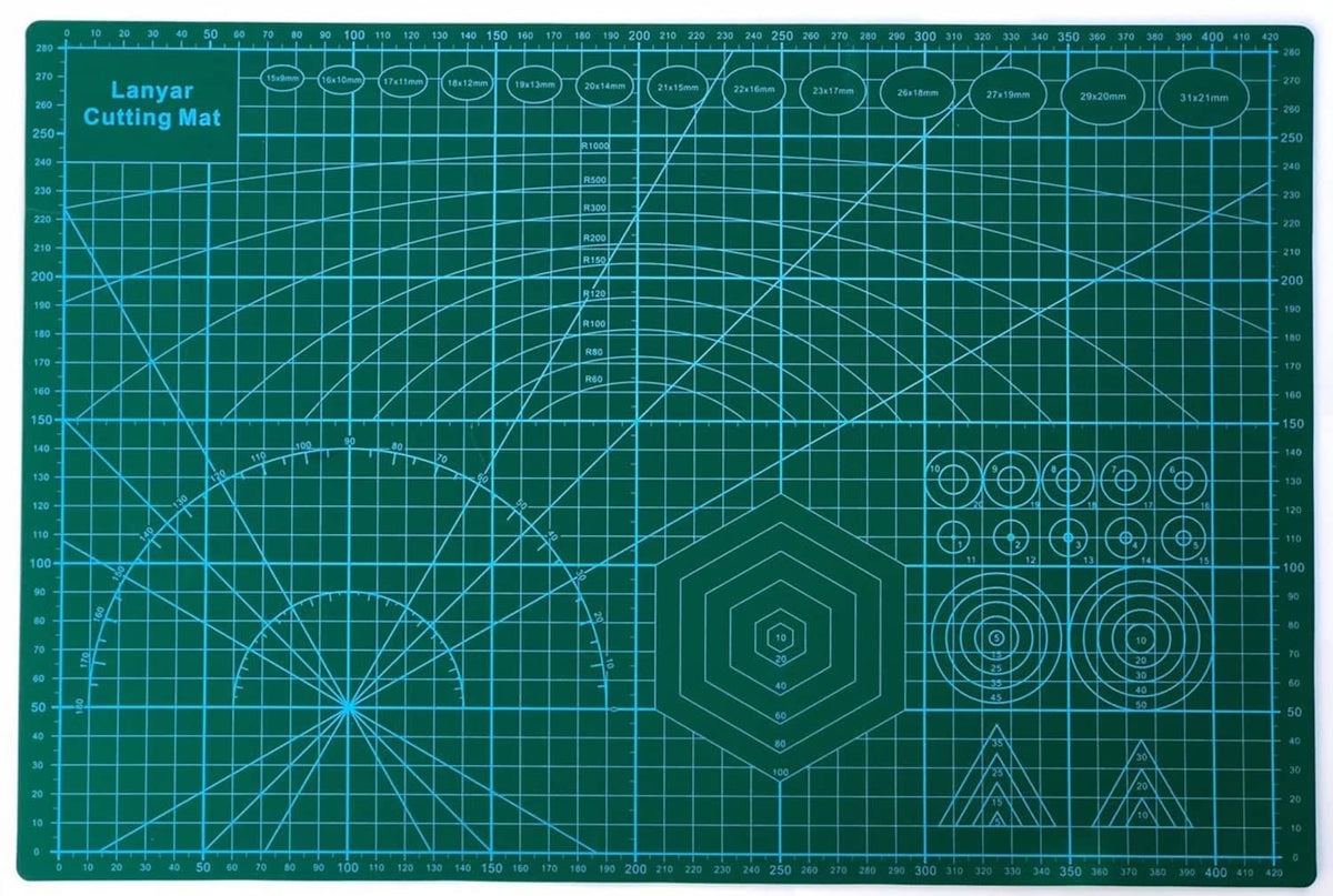 Blue cutting mat with printed grid and protractor lines, 18 x 12 in