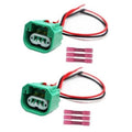 Green headlight wiring connector with red/black wires and pink terminal plugs