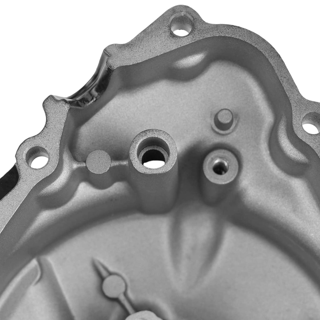 Left crankcase stator cover, aluminum-style metal with mounting holes and openings.