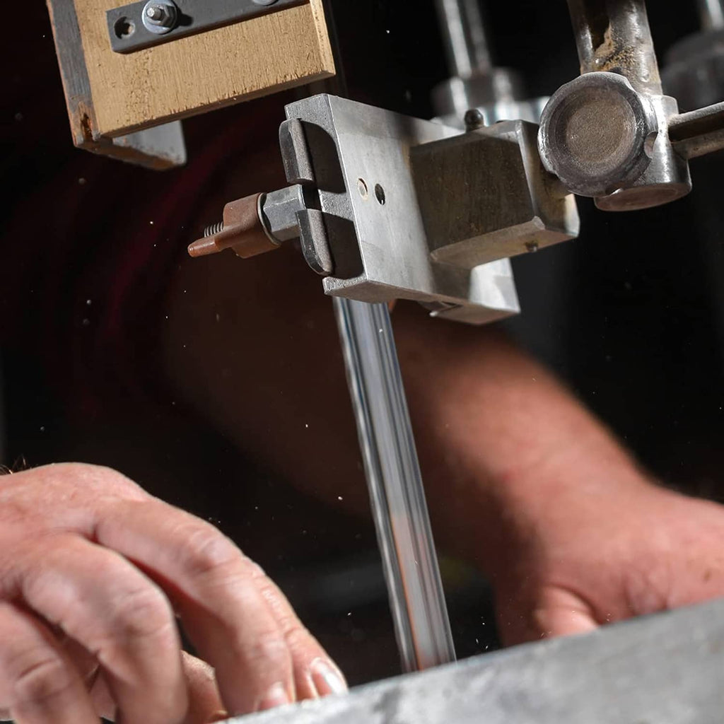 Band saw blade and metal guides cutting wood on a bandsaw