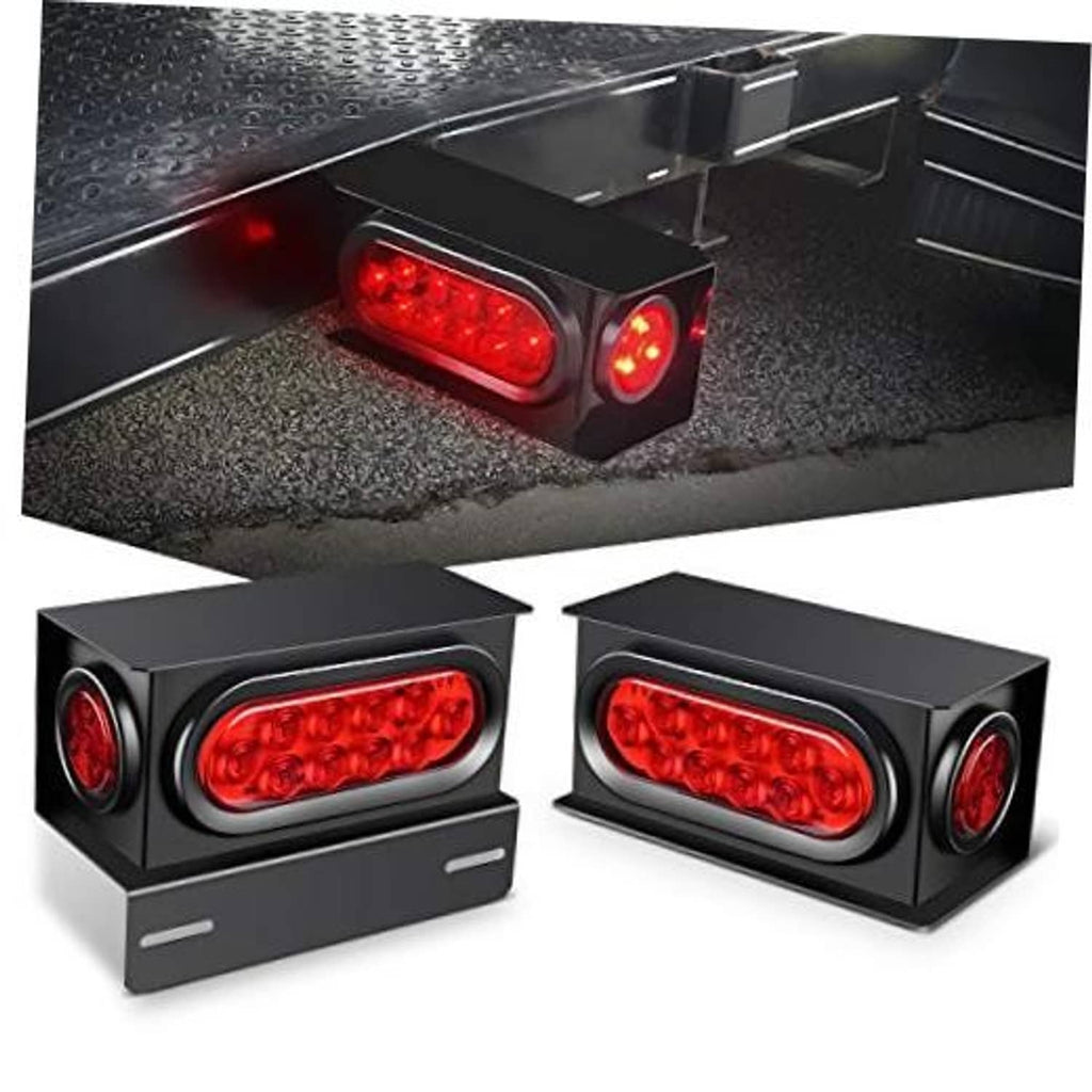 Red oval LED trailer light and round marker lights in black steel housings