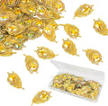 Gold rhinestone feather flatbacks scattered with clear plastic storage tray