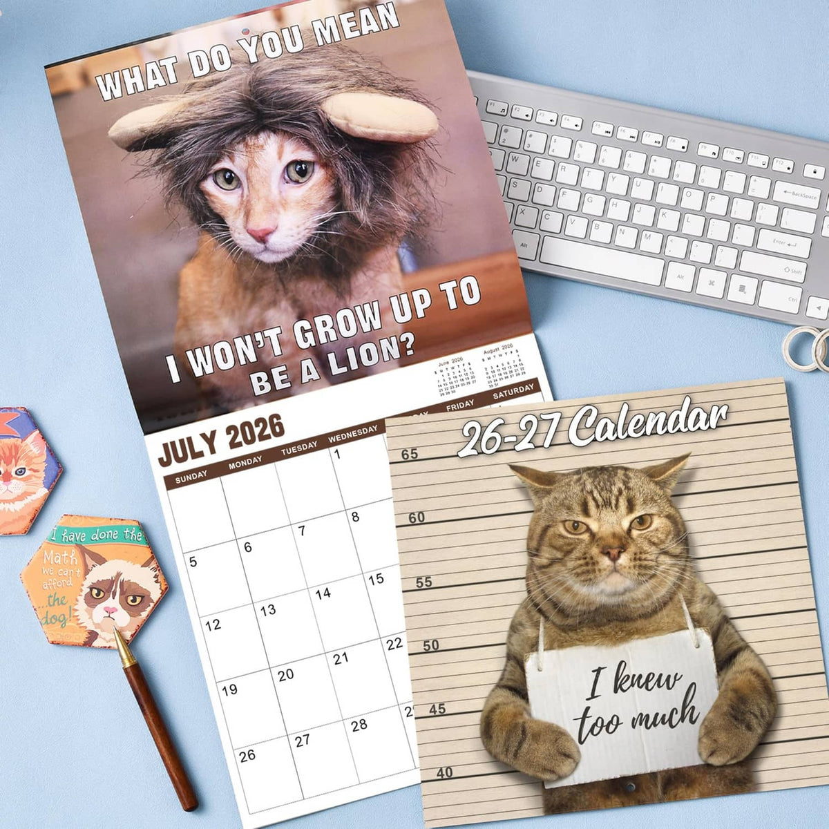 Brown cat wall calendar with July 2026 grid page and “26-27 Calendar” title