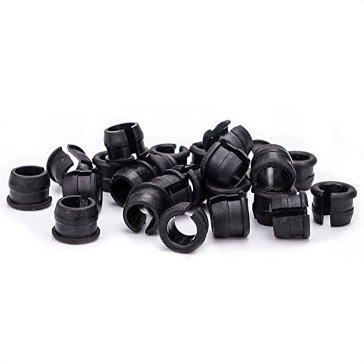 Black rubber valve stem adapters, loose pile of Schrader-to-Presta grommets