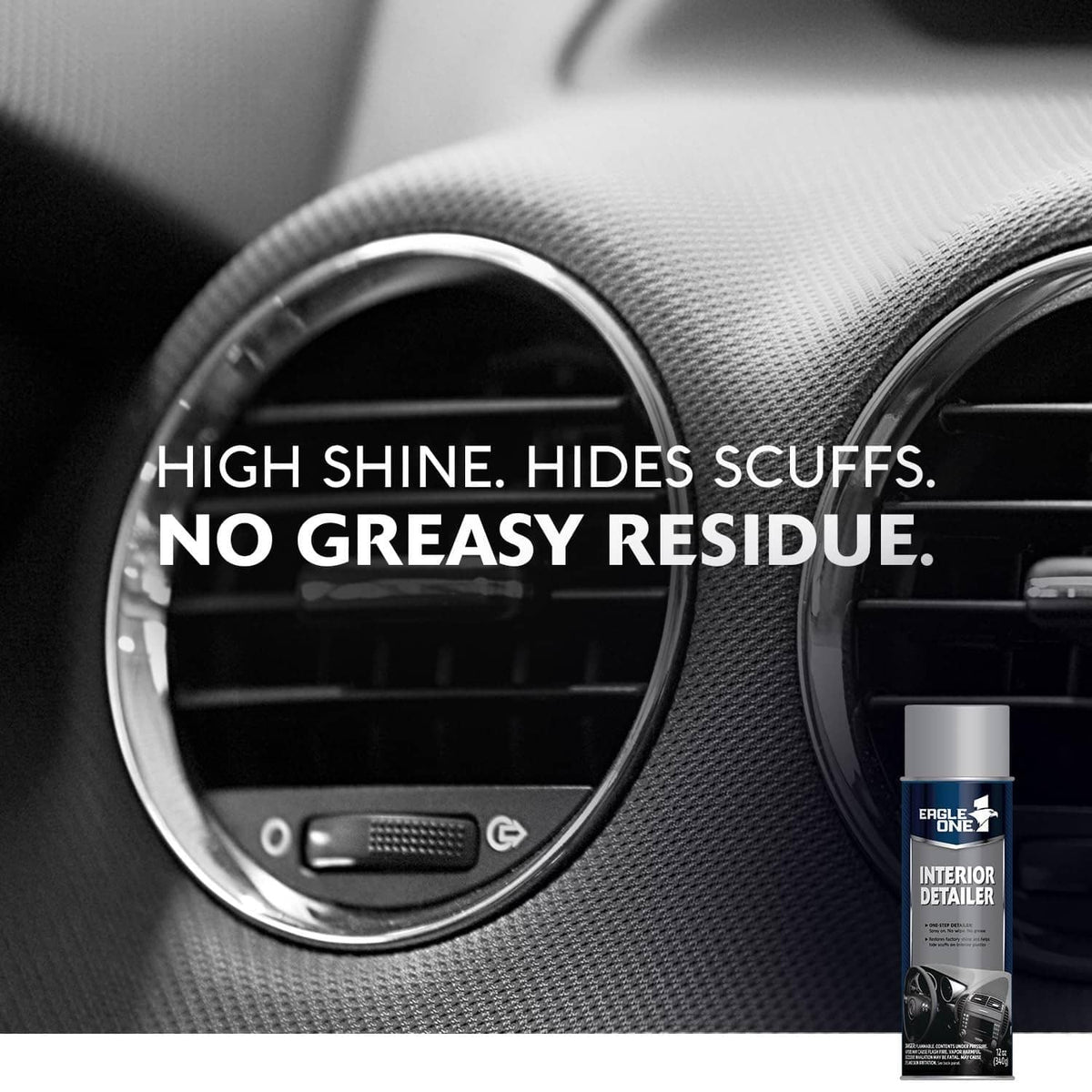 Interior detailer spray bottle beside dashboard air vent on dark textured panel