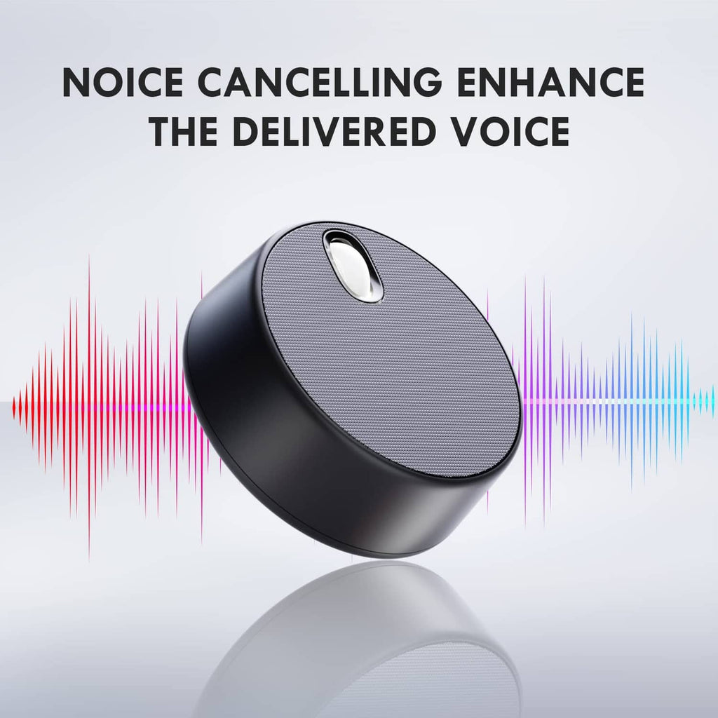 Angled black USB speaker with textured grille and small control button