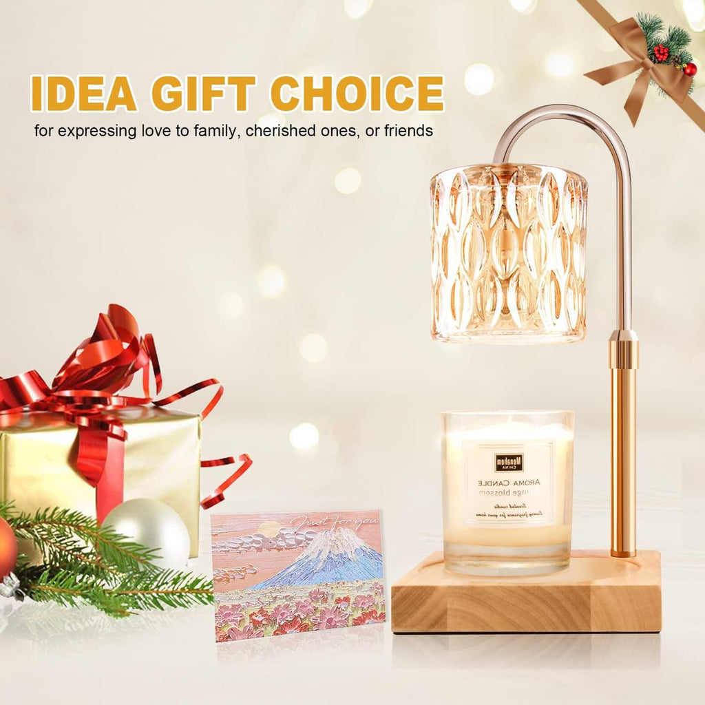 Gold candle warmer lamp with amber glass shade on a wooden base