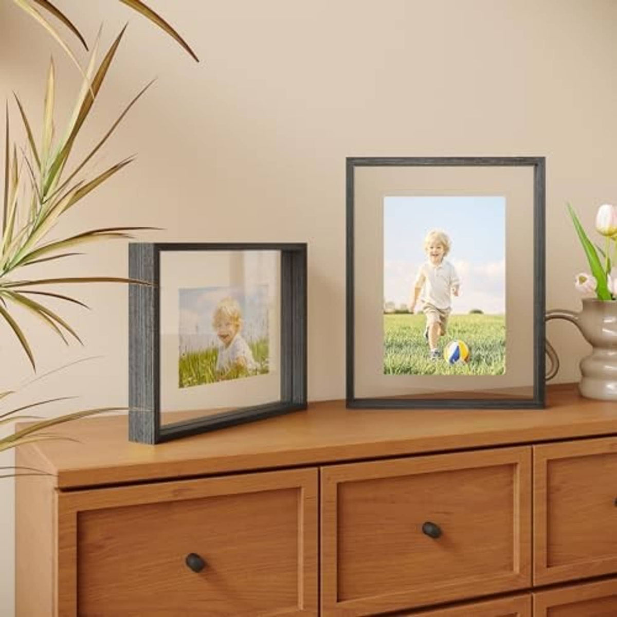 Faded black 11x14 floating frames, double-plexiglass front with photo inserted on tabletop