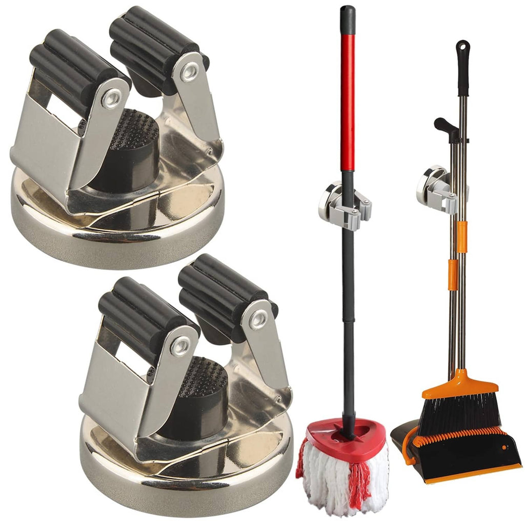 Magnetic broom holder with two black clamp arms and silver circular base