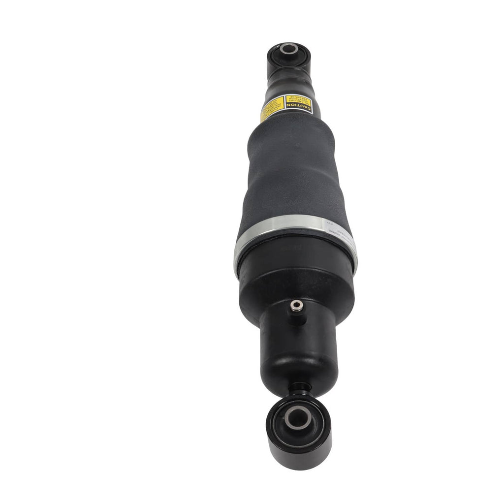 Pair of rear air suspension shock struts, front view of black shock with bottom eye mount