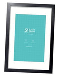 Black picture frame with mat, showing turquoise poster insert.