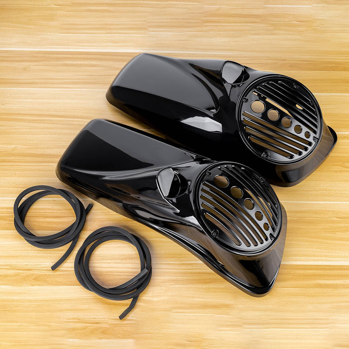 Two black speaker lids with vented grilles and included black rubber seal rings