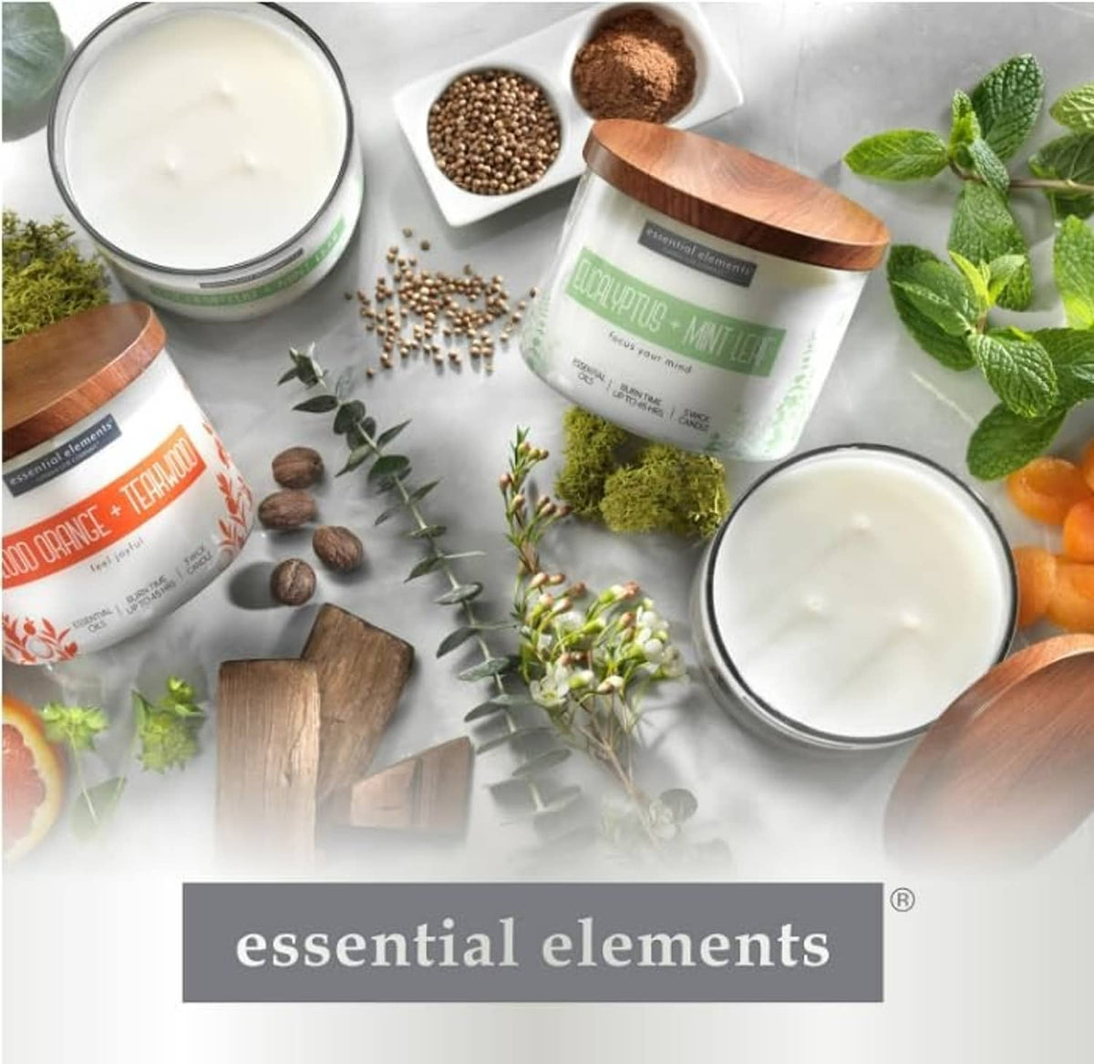 Eucalyptus mint leaf candle jar with green label among candles and mint sprigs