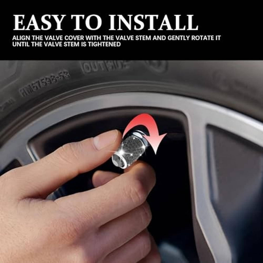 Hand installing a rhinestone-look tire valve stem cap onto a tire valve
