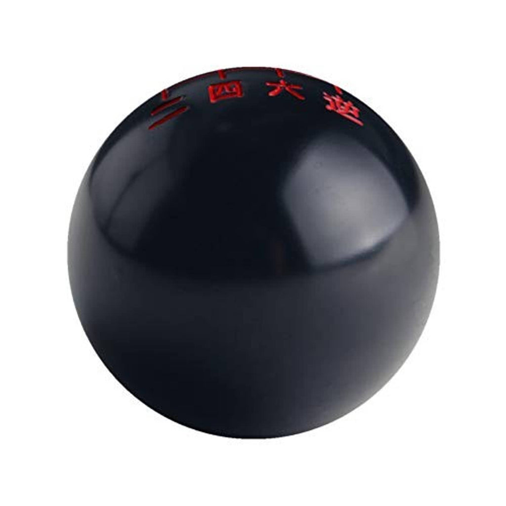 Black shift knob with red Chinese gear markings on curved top