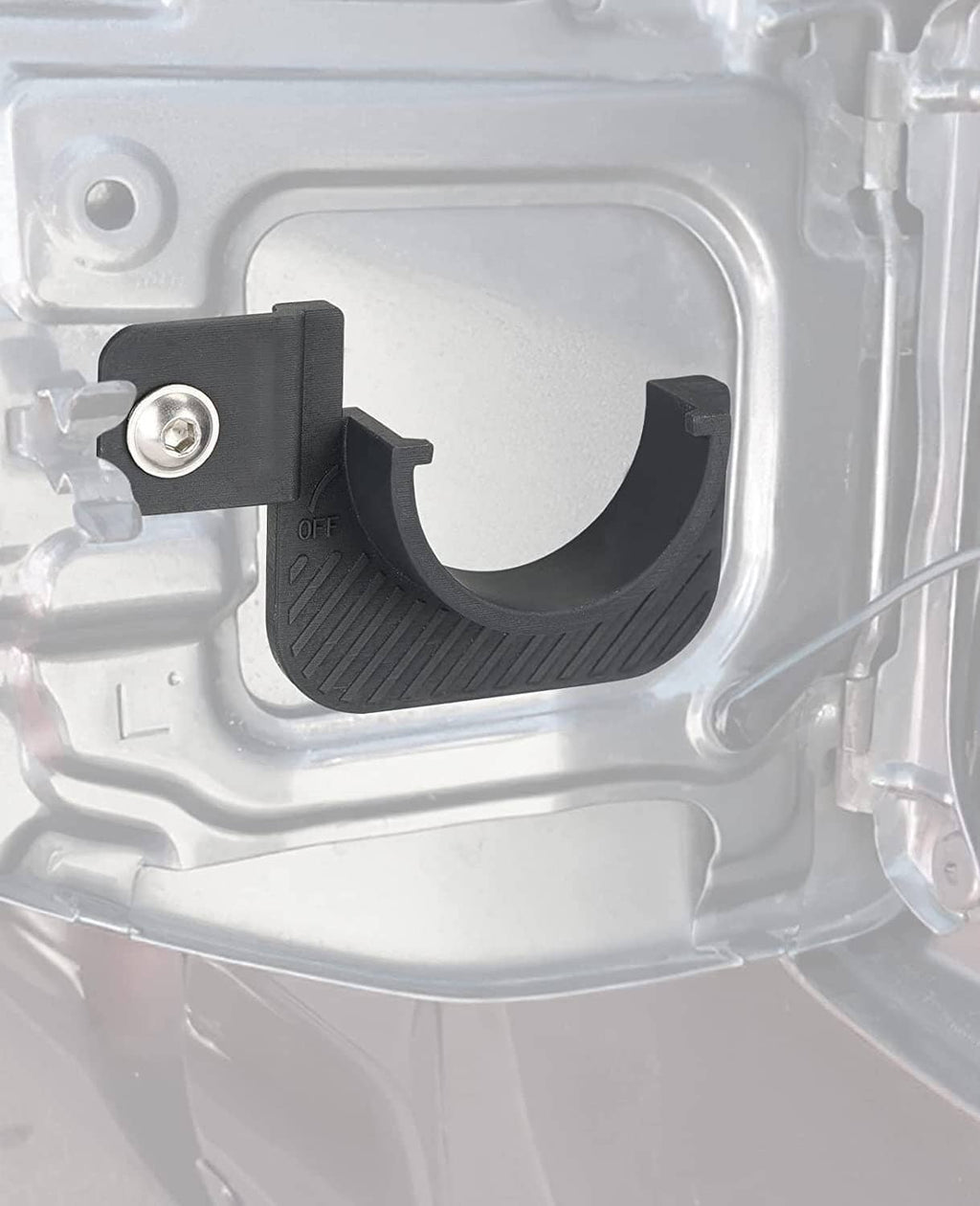 Black gas cap holder trim installed in fuel cap housing