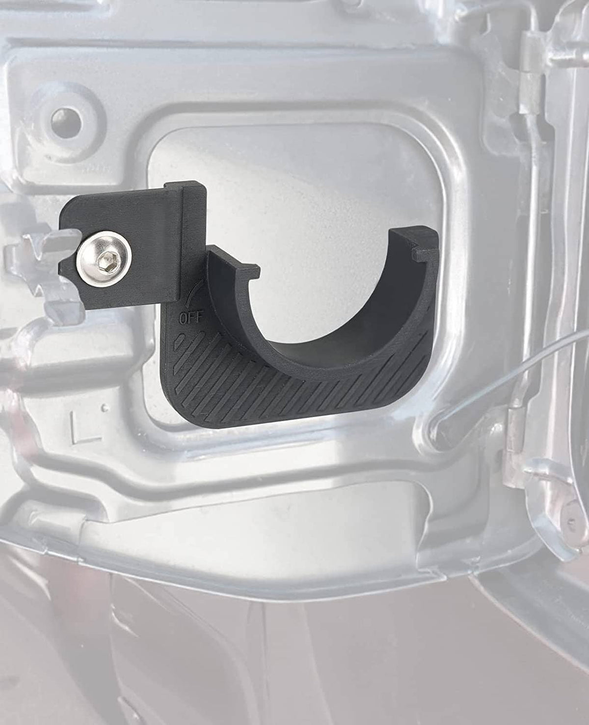 Black gas cap holder trim installed in fuel cap housing