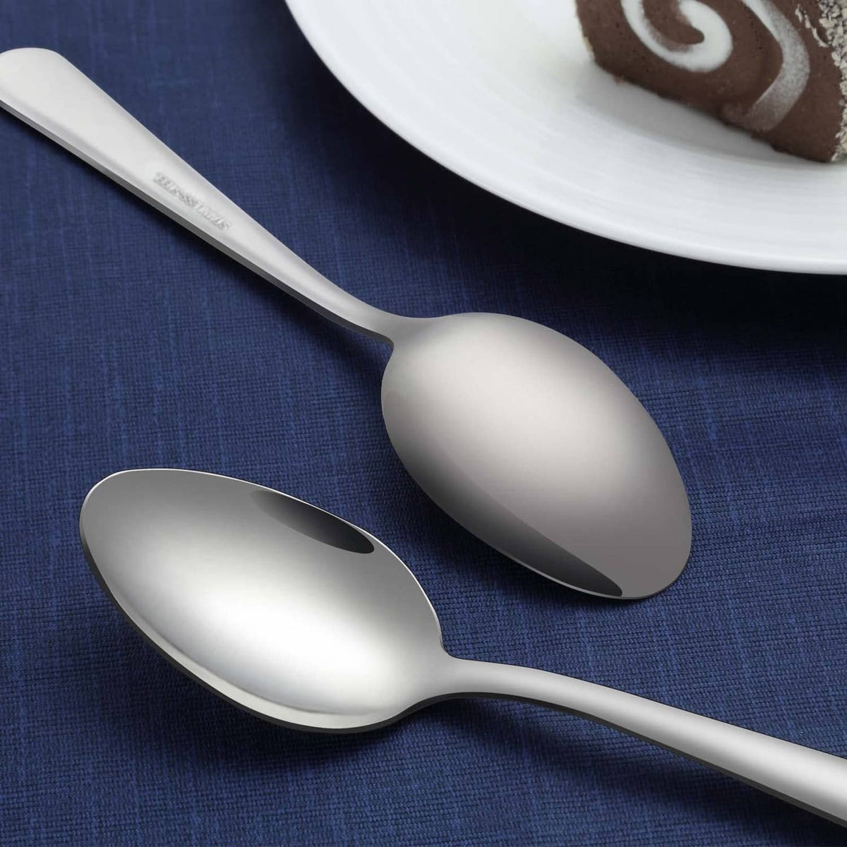 Funnydin stainless dinner spoons, polished silver, two spoons shown side-by-side