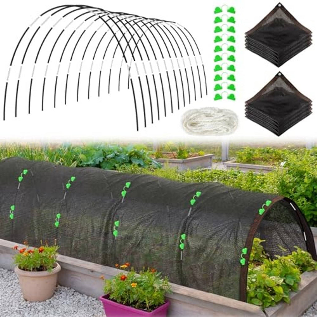 Black shade net tunnel over raised bed with arched hoop support and plants