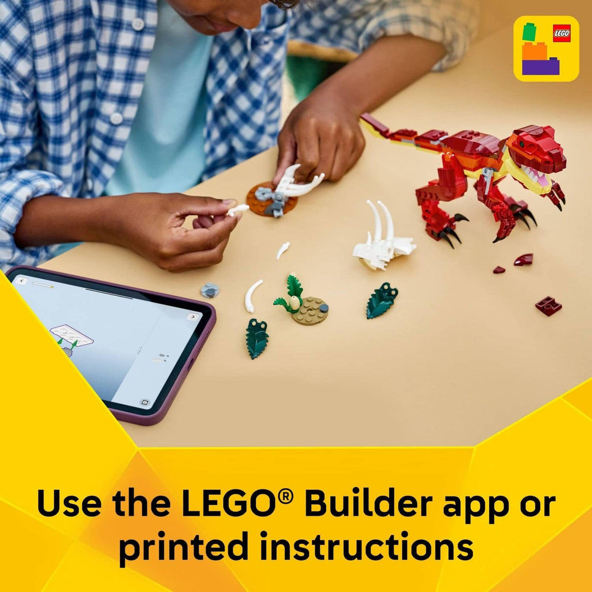 LEGO Creator dinosaur building toy being assembled with small red and white parts on a table
