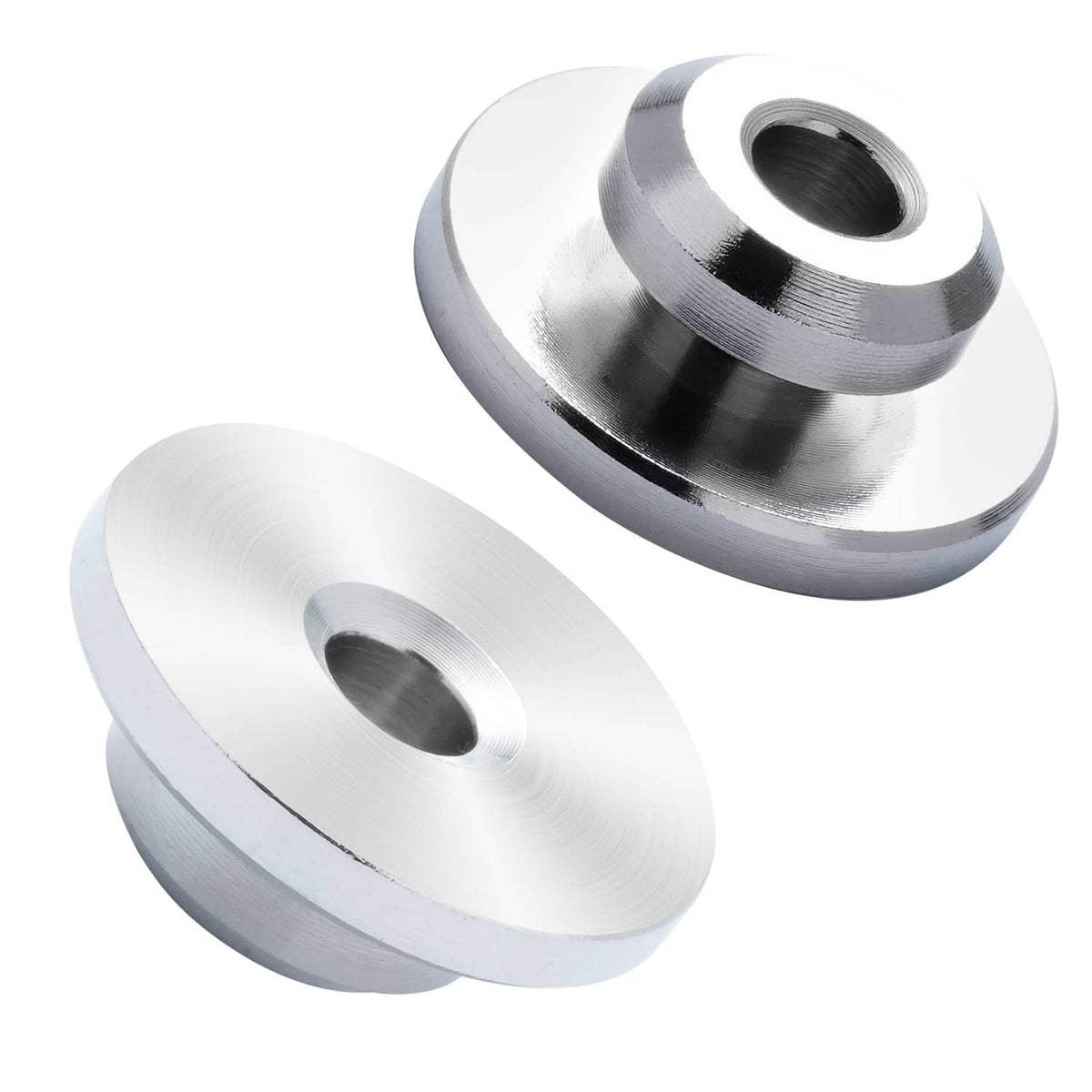 Pair of stainless steel cable railing wheel protector sleeves with central holes close-up