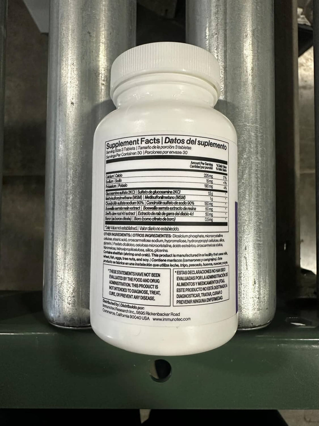 Dietary supplement bottle with back label facing camera